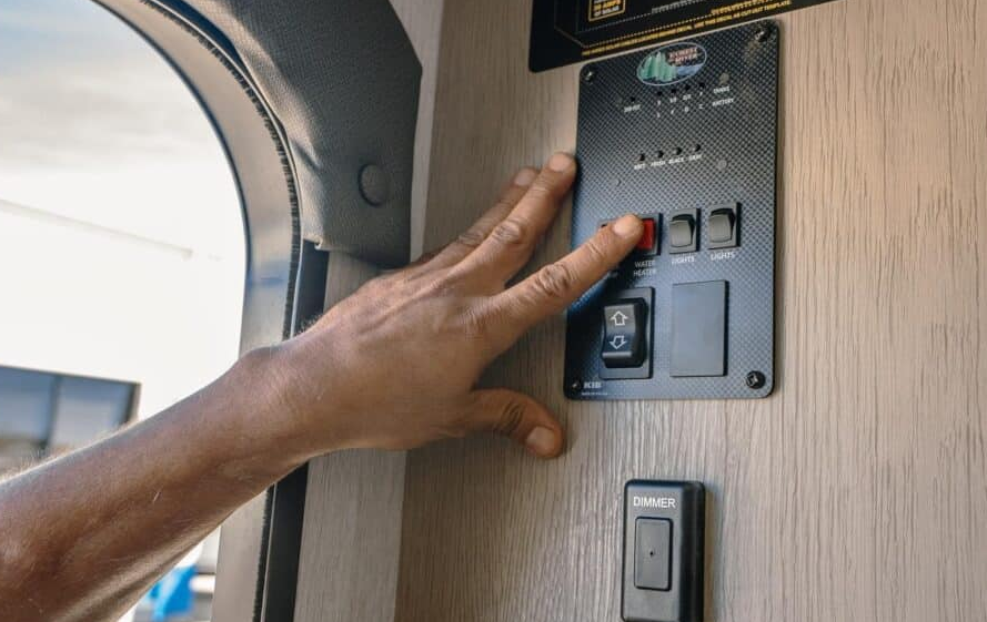 Suburban RV water heater with cover removed during repair